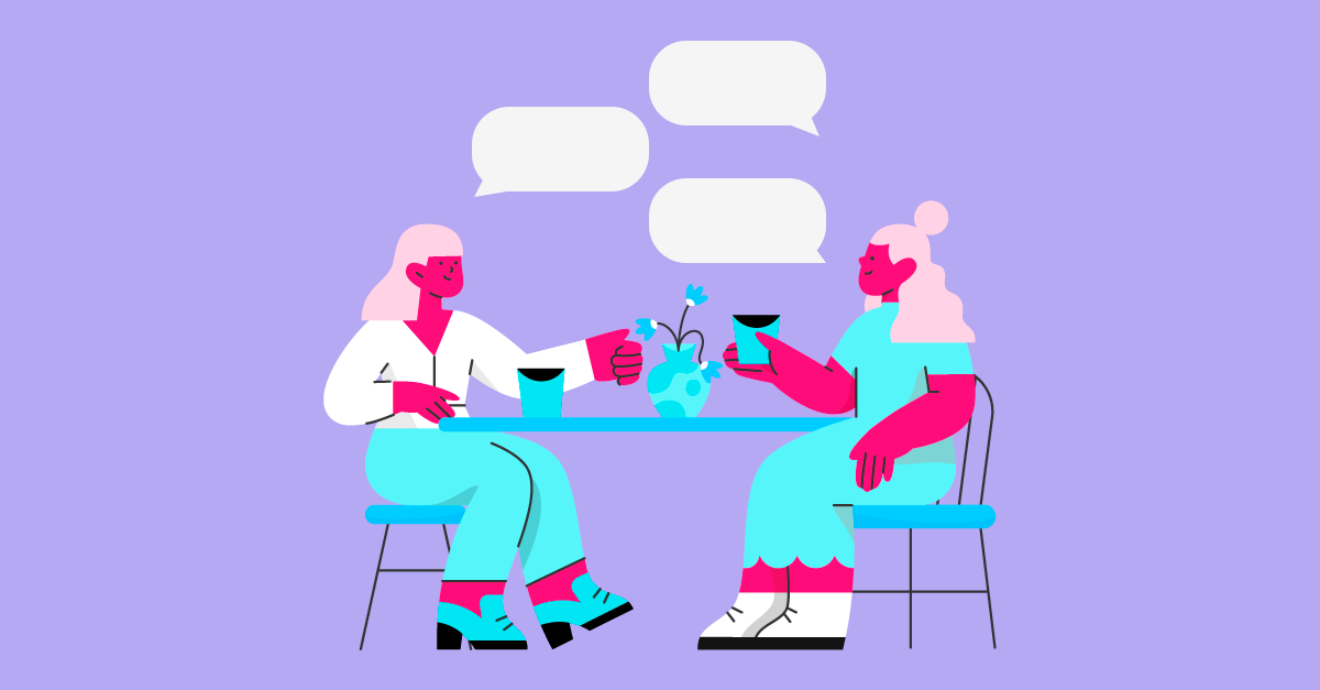 Duas mulheres conversando em um café moderno