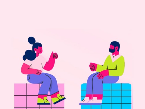 Duas pessoas conversando de forma descontraída