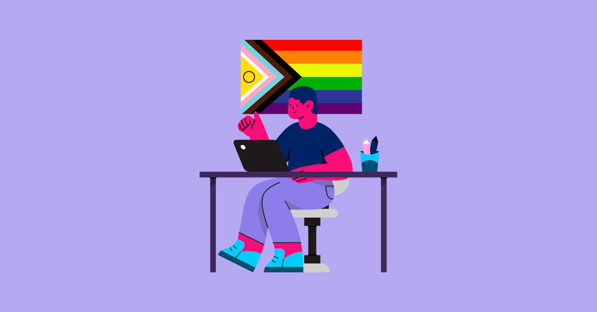 Pessoa trabalhando em laptop com arte LGBTQIAPN+ ao fundo